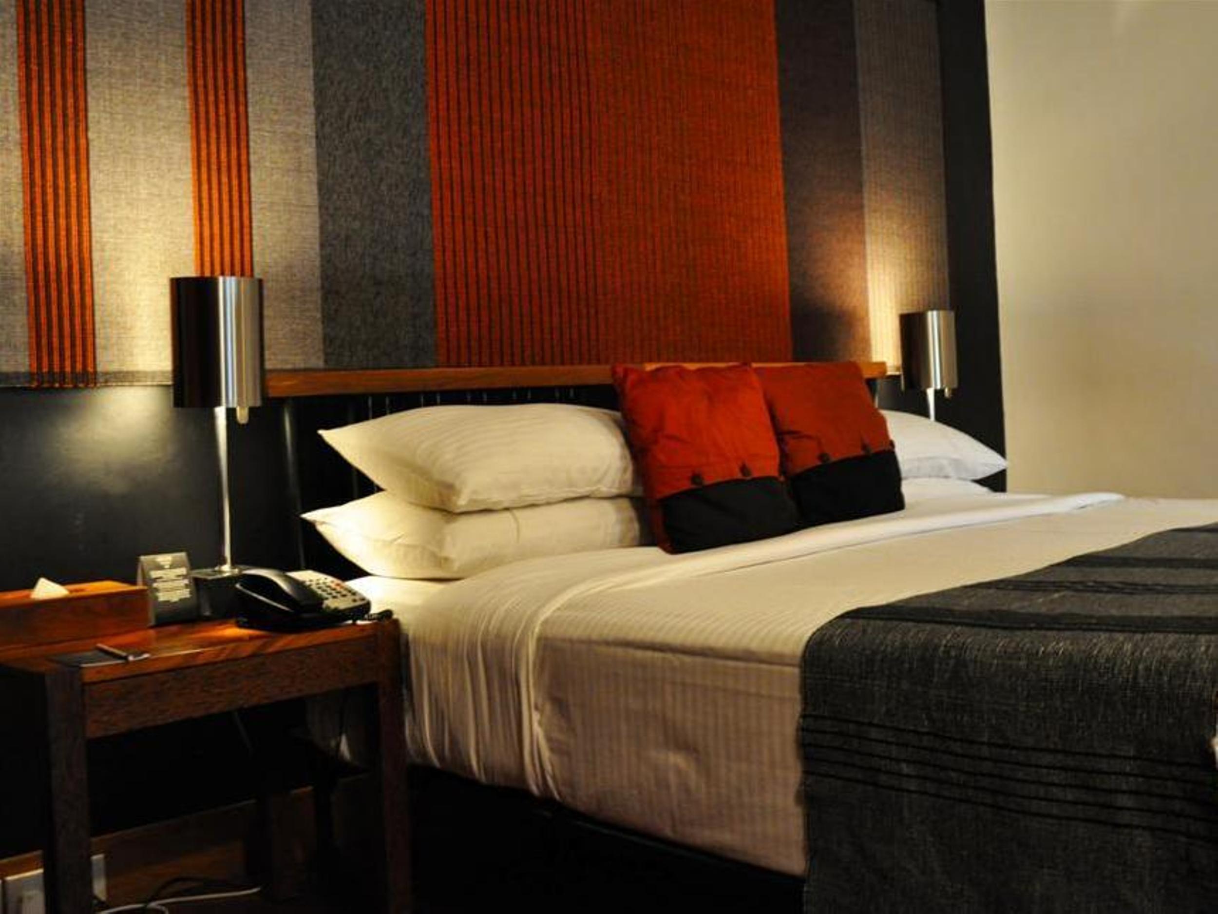 Heritance Kandalama Sigiriya Bagian luar foto A bedroom at the hotel